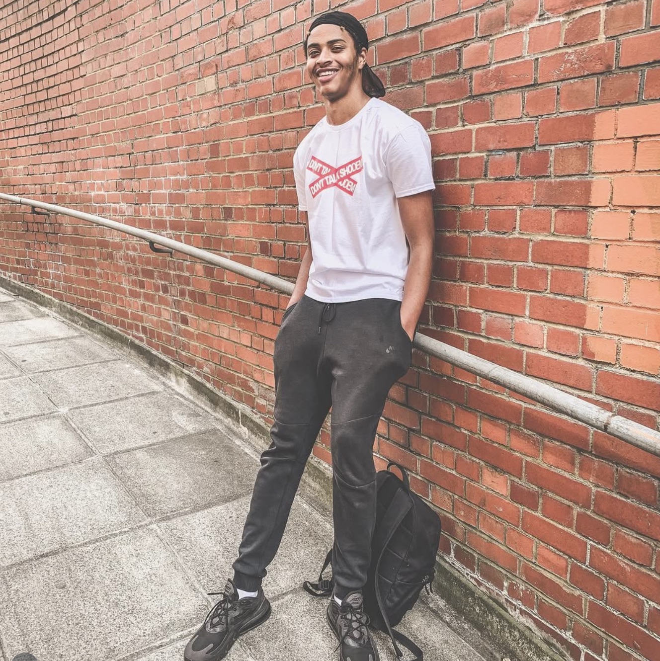 Donttalkshodem — Red crossed wordmark on a white T-shirt